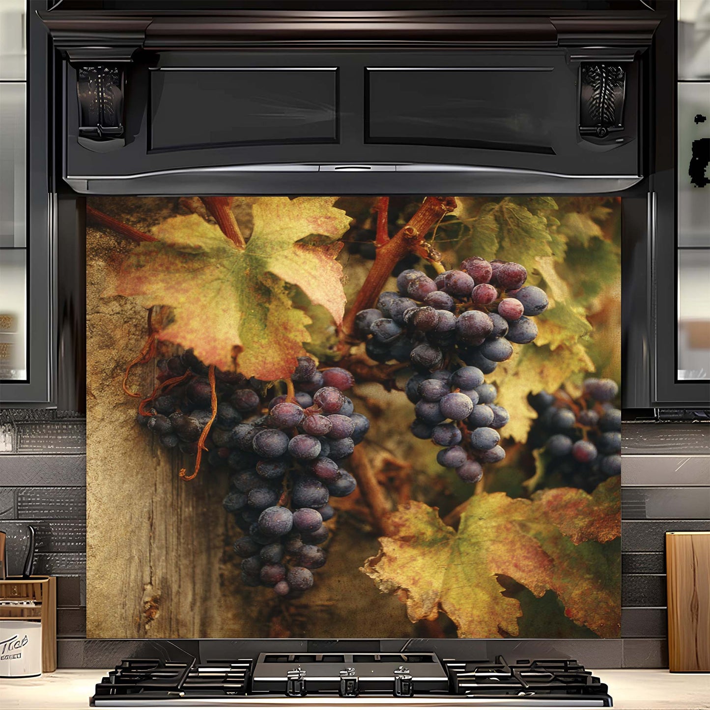 Stove with decorative glass backsplash featuring grapes and leaves