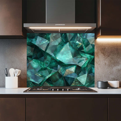 Kitchen with a green geometric patterned glass backsplash