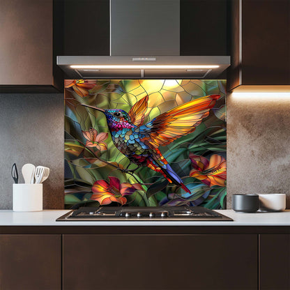 Kitchen with a colorful hummingbird and floral design on a glass splashback.
