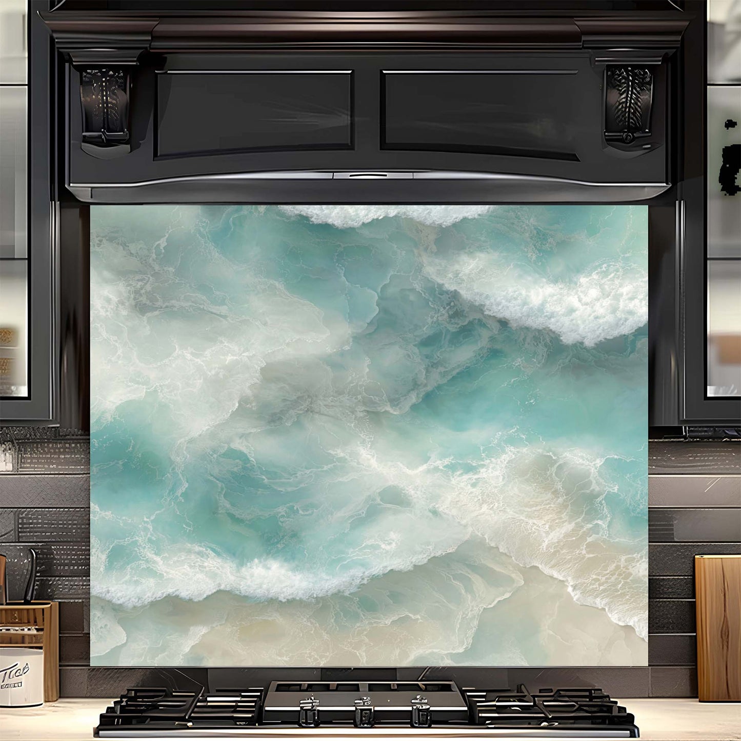 Black oven with a decorative glass backsplash featuring ocean waves and beach scene