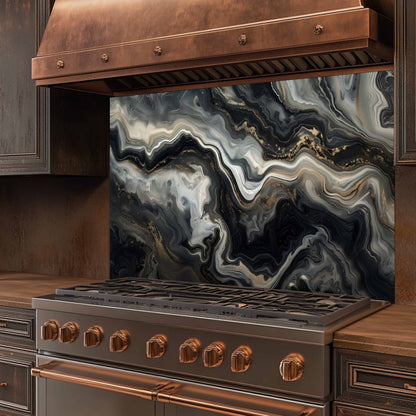 Stainless steel stove with copper accents and a marbled backsplash in a kitchen setting.
