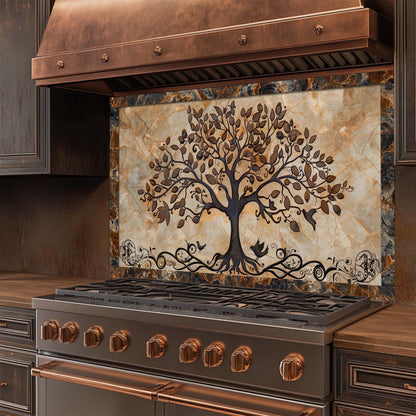 Stainless steel stove with decorative glass backsplash featuring a tree design in a kitchen setting.