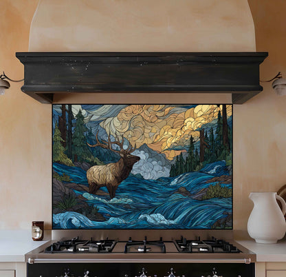 Stylized elk in a forest glass backsplash on a kitchen wall above a stove.
