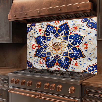 Stainless steel stove with decorative glass backsplash featuring a floral pattern.
