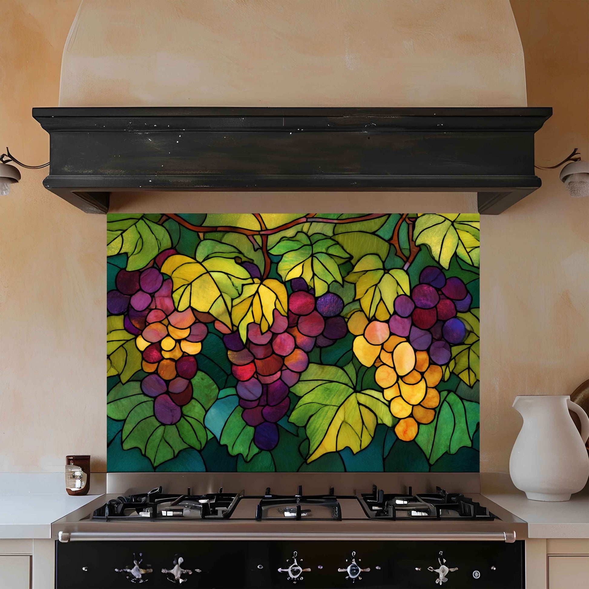 Colorful stained glass-style backsplash with grapes above a stove in a kitchen.