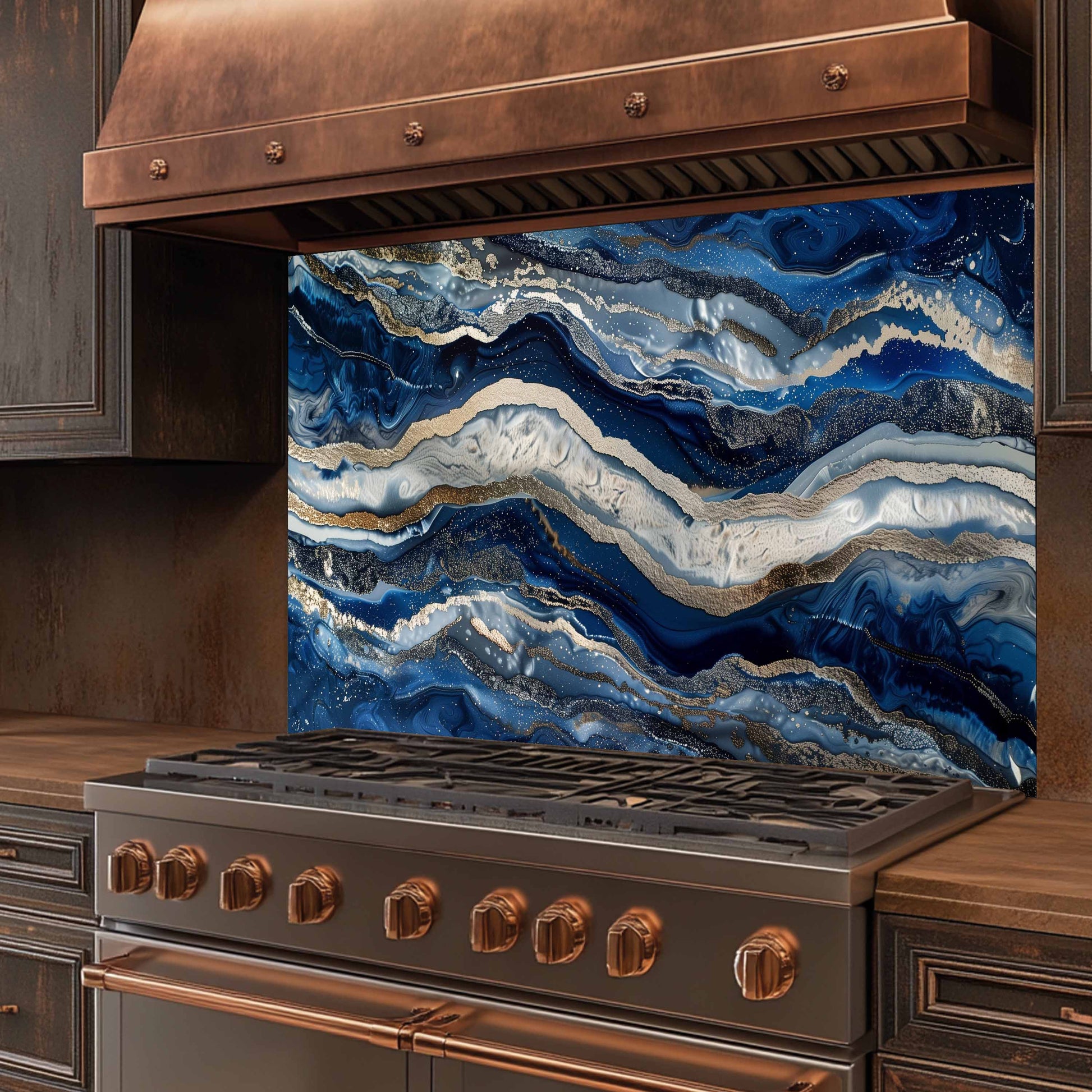 Stainless steel stove with copper accents and a blue marbled backsplash.
