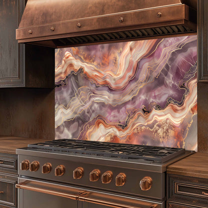 Stainless steel stove with copper accents and a colorful agate-style backsplash.