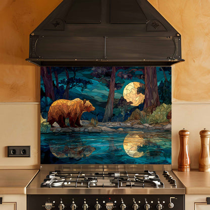 Stainless steel stove with a decorative glass splashback featuring a bear and moonlit forest design.
