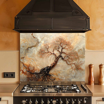 Stainless steel stove with decorative glass splashback featuring tree design in a kitchen setting.