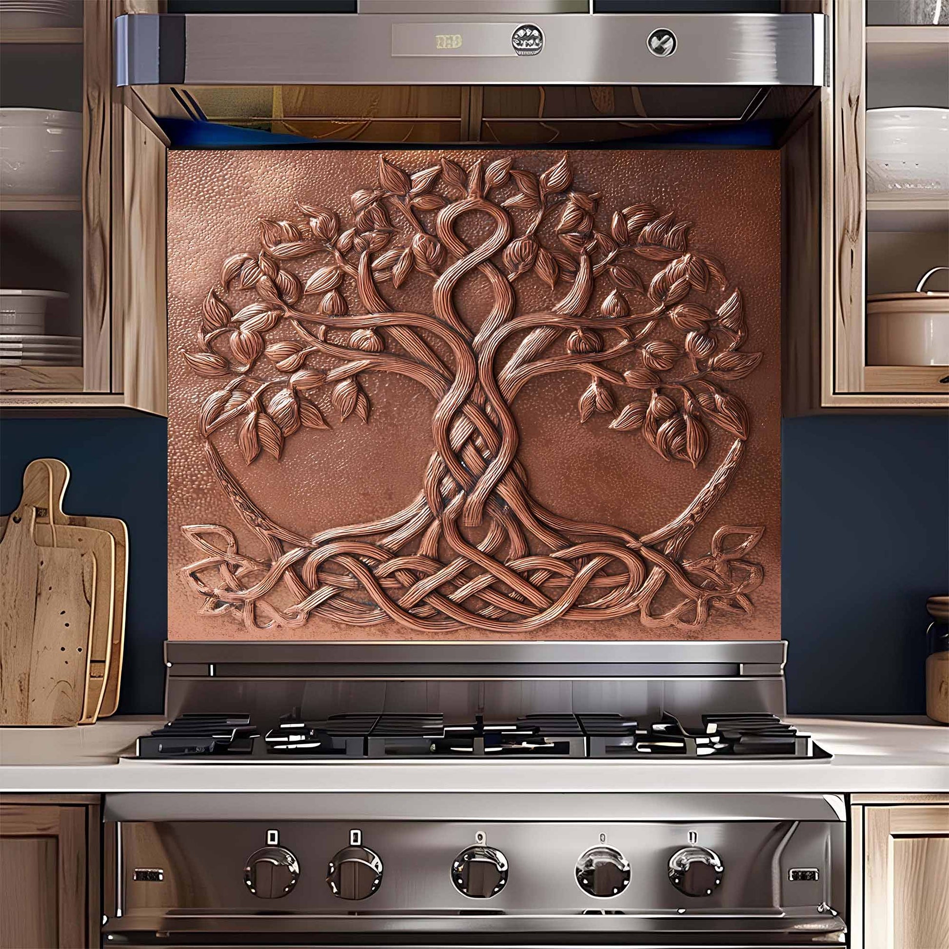 Stainless steel stove with decorative copper tree glass backsplash in a kitchen setting