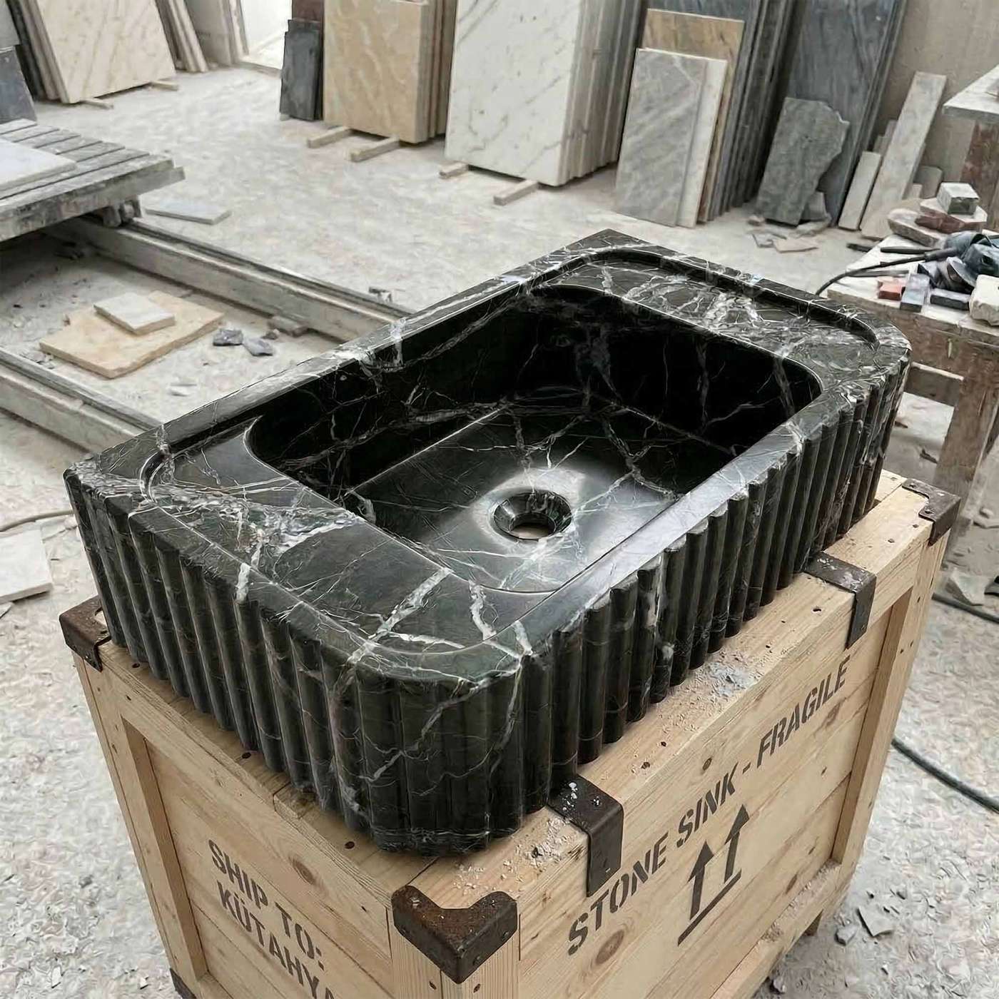 Marble sink on a wooden crate with construction materials in the background