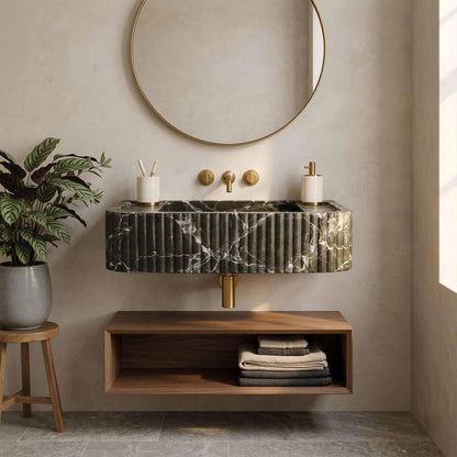 Bathroom with marble sink, wooden cabinet, and round mirror.