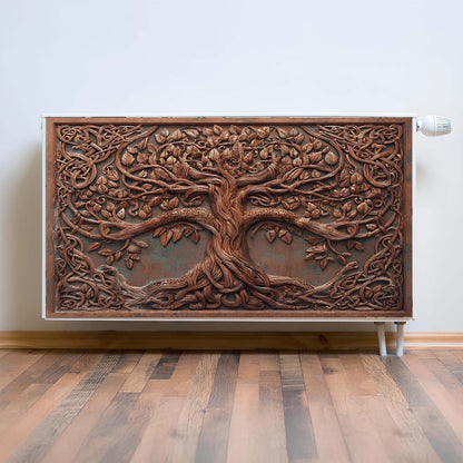 Decorative magnetic radiator cover  with tree design on a wall.