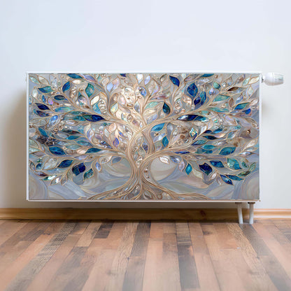 Decorative magnetic radiator cover with a tree design on a wall.