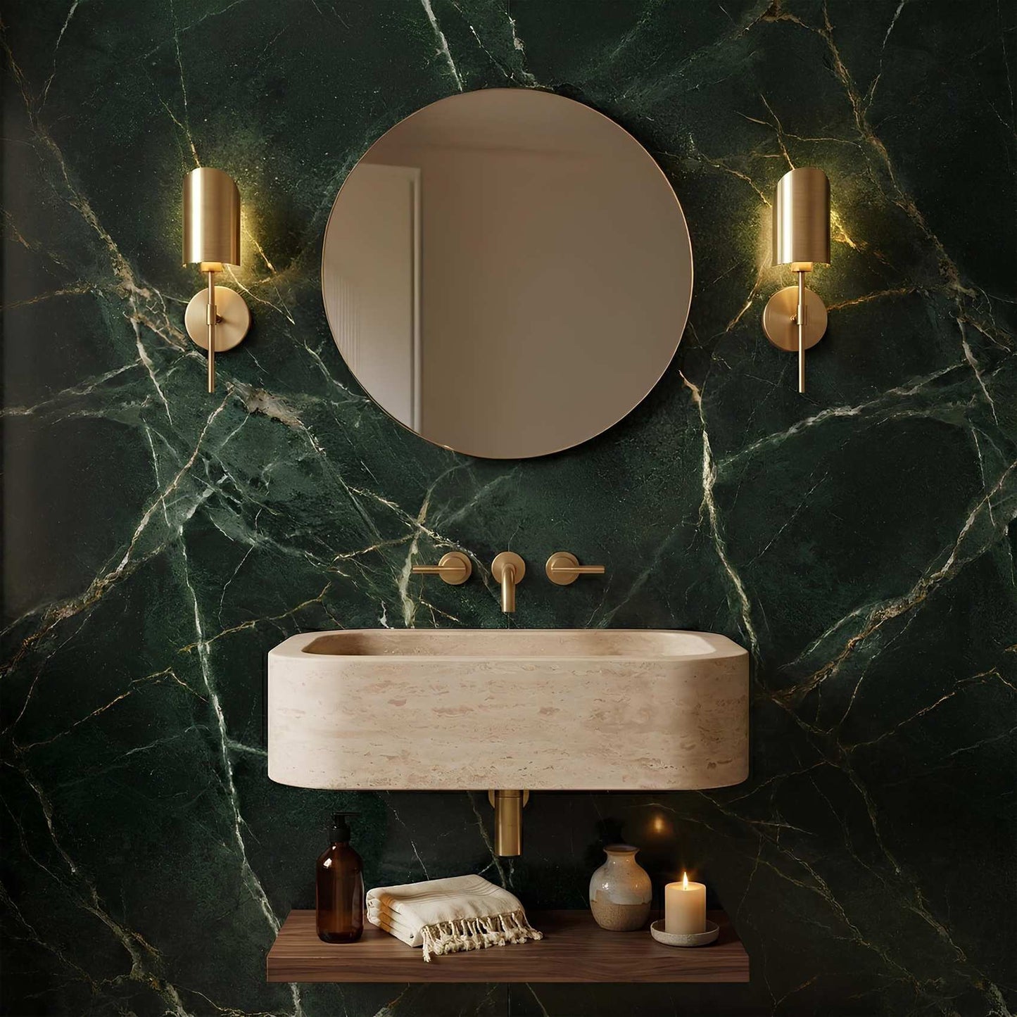 Bathroom setup with a round mirror, sink, and decorative items on a green marble wall.
