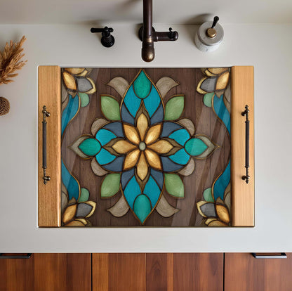 Decorative stove top cover with stained glass design on a white sink.