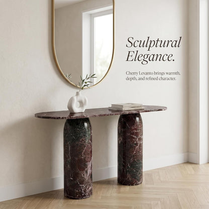 Marble console table with a mirror and decor items in a room setting.