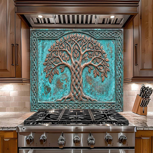 Stainless steel gas stove with decorative glass backsplash featuring a tree design in a kitchen setting.