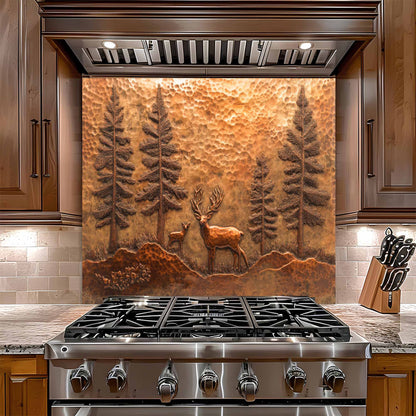 Stainless steel gas stove with decorative glass backsplash featuring a deer and trees in a forest scene.