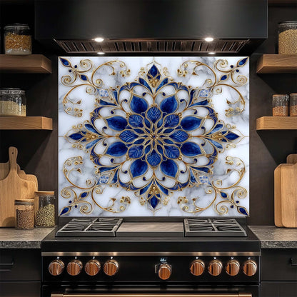 Decorative glass backsplash with blue and gold floral pattern above a stove in a kitchen.
