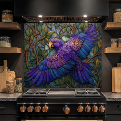 Kitchen stove with a colorful parrot mural on the glass backsplash