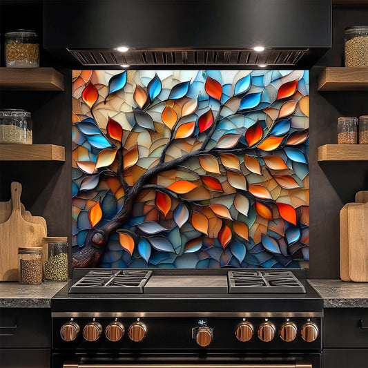 Stainless steel oven with a colorful leaf design glass backsplash in a kitchen setting.