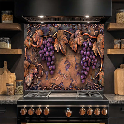 Decorative glass backsplash with grapes and leaves above a stove in a kitchen.