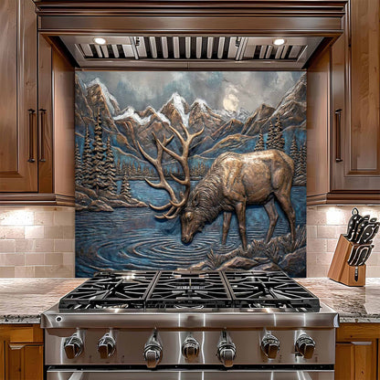 Stainless steel stove with decorative elk and mountain glass backsplash in a kitchen setting