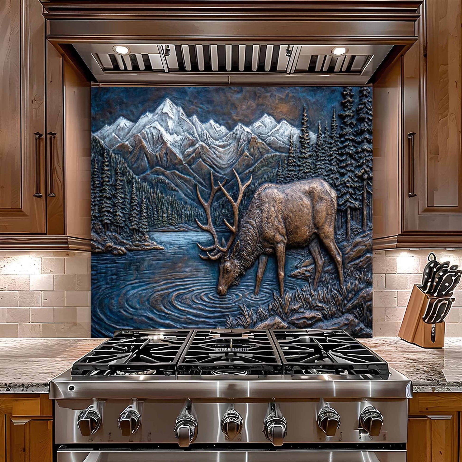 Stainless steel gas stove with a decorative glass backsplash featuring a deer and mountain scene in a kitchen.