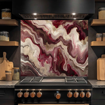 Stainless steel stove with marbled backsplash in a kitchen setting