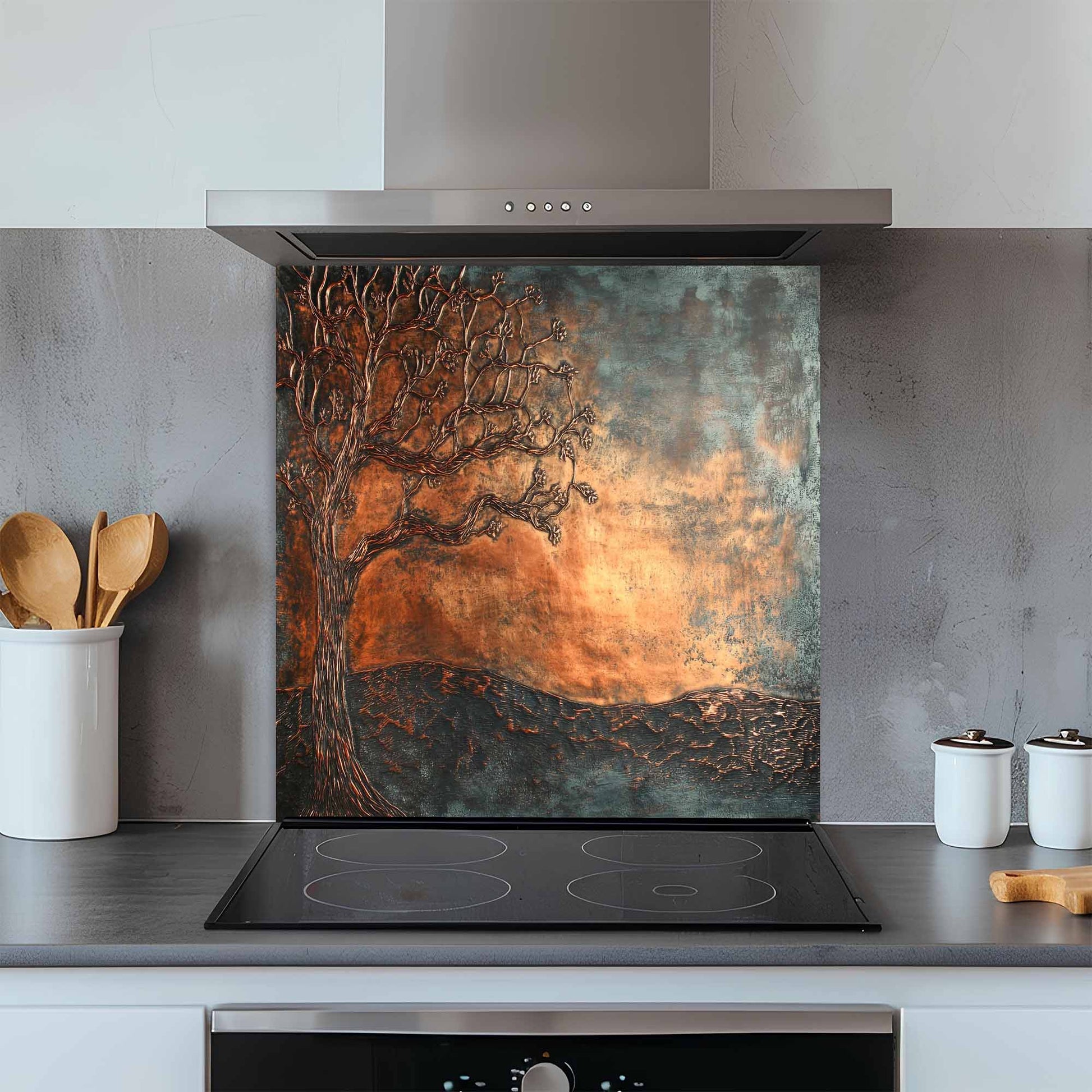 Kitchen with a decorative glass splashback featuring a tree design.
