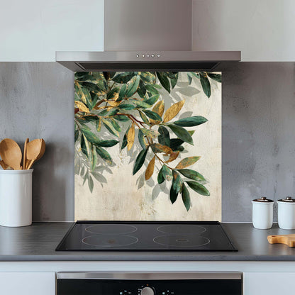 Kitchen glass backsplash with leaf design above a stove