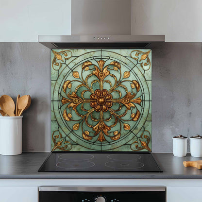 Decorative glass splashback with floral design above a kitchen stove.