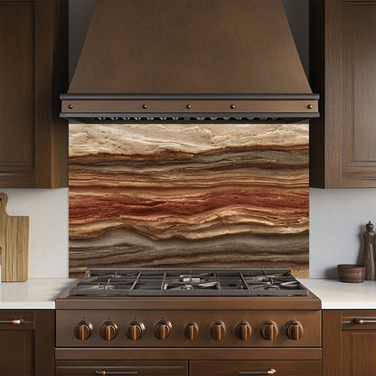 Kitchen stove with a decorative glass backsplash and wooden hood.