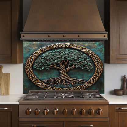 Decorative glass backsplash with a tree design above a stove in a kitchen.