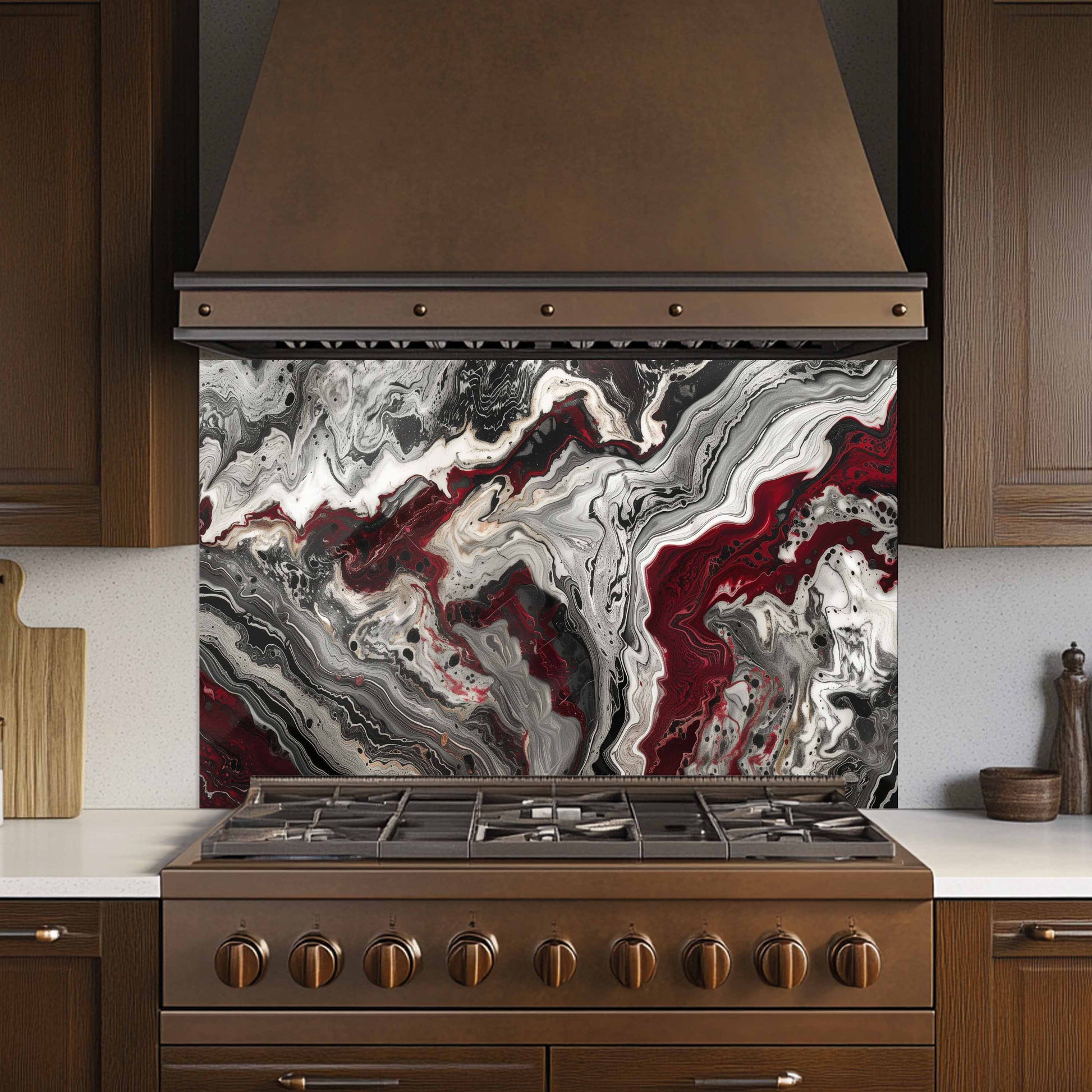 Kitchen stove with a marbled backsplash and brown hood