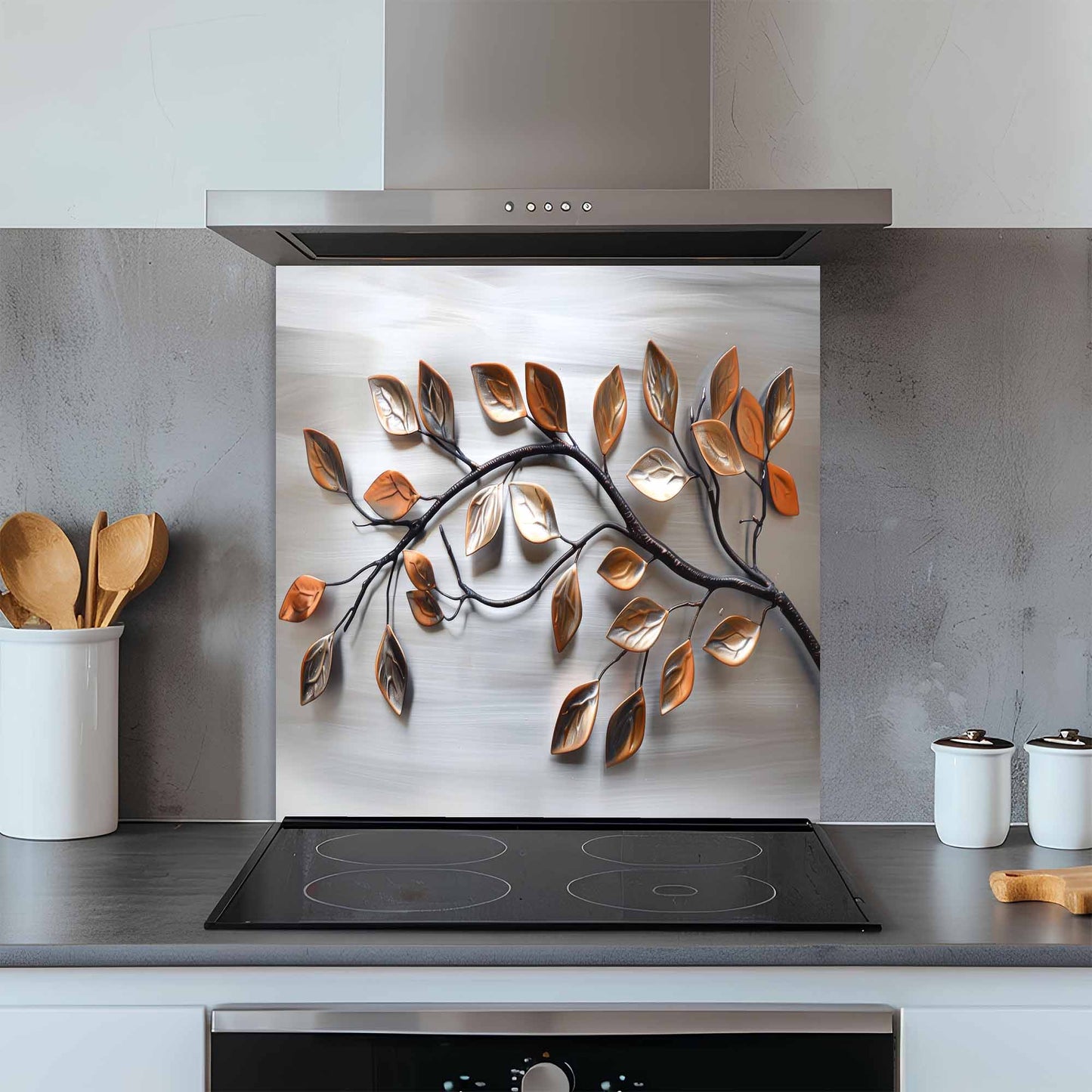 Modern kitchen with a decorative glass splashback featuring leaf designs.