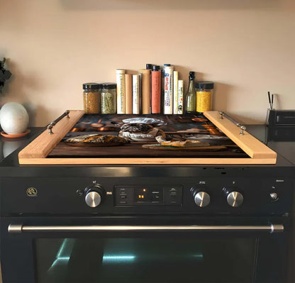 Black stove with wooden cutting board on top, books, and jars in the background.