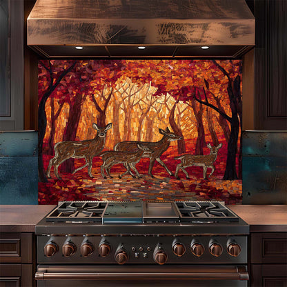 Stainless steel stove with deer backsplash on the wall behind it