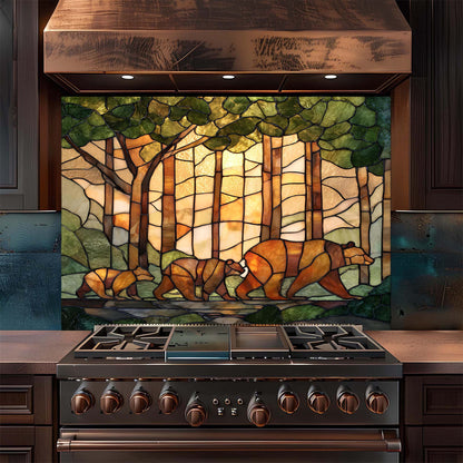 Stainless steel stove with stained glass backsplash featuring bears in a forest