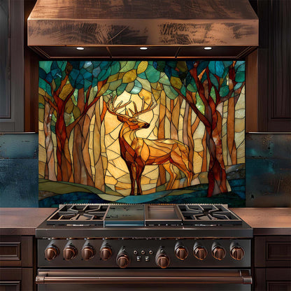 Stainless steel stove with a decorative glass backsplash featuring a deer in a forest design.