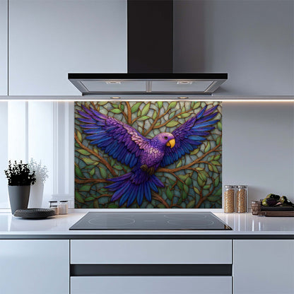 Kitchen with a colorful parrot design on a glass splashback above a stove.