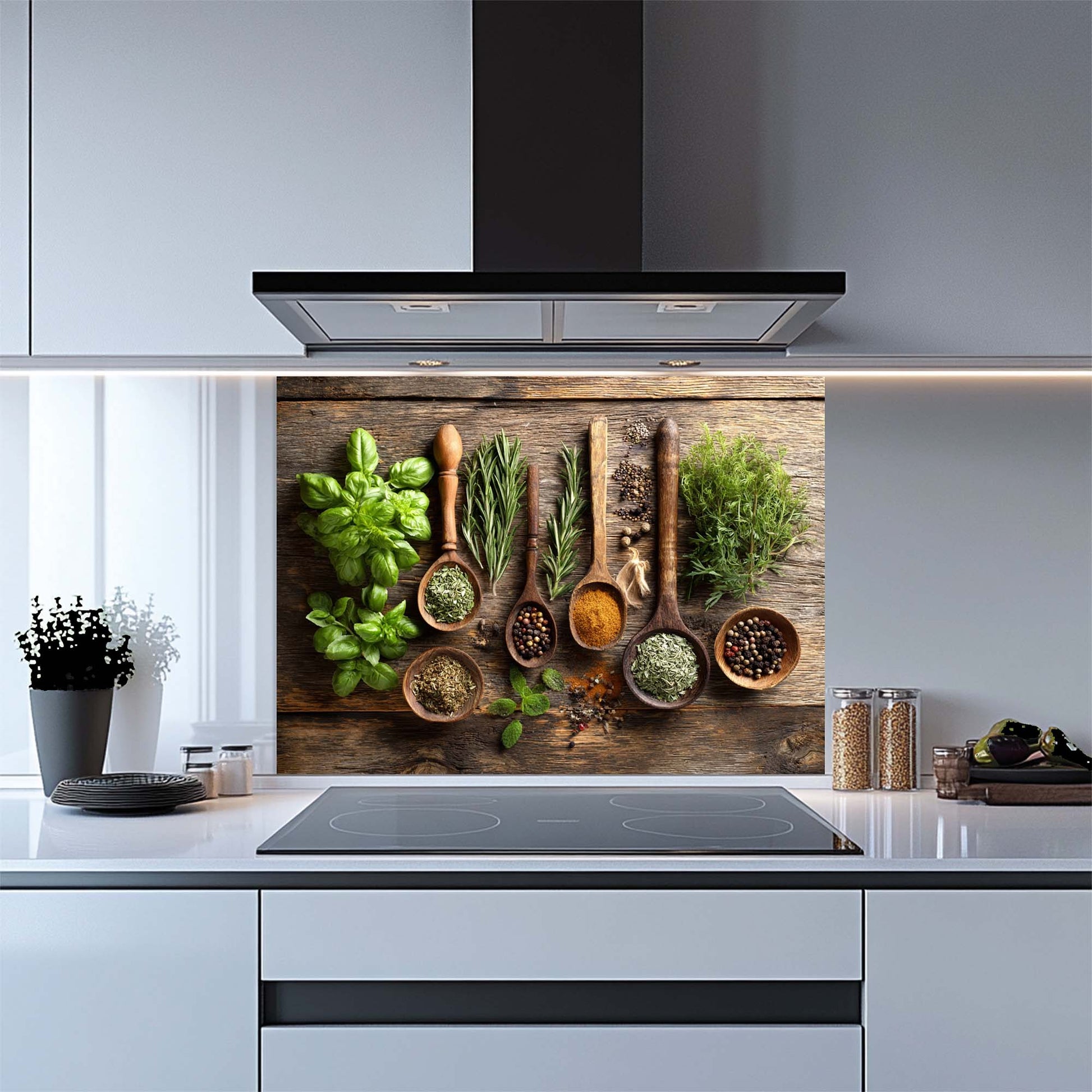 Kitchen glass backsplash with wooden spoons and herbs on a wooden background