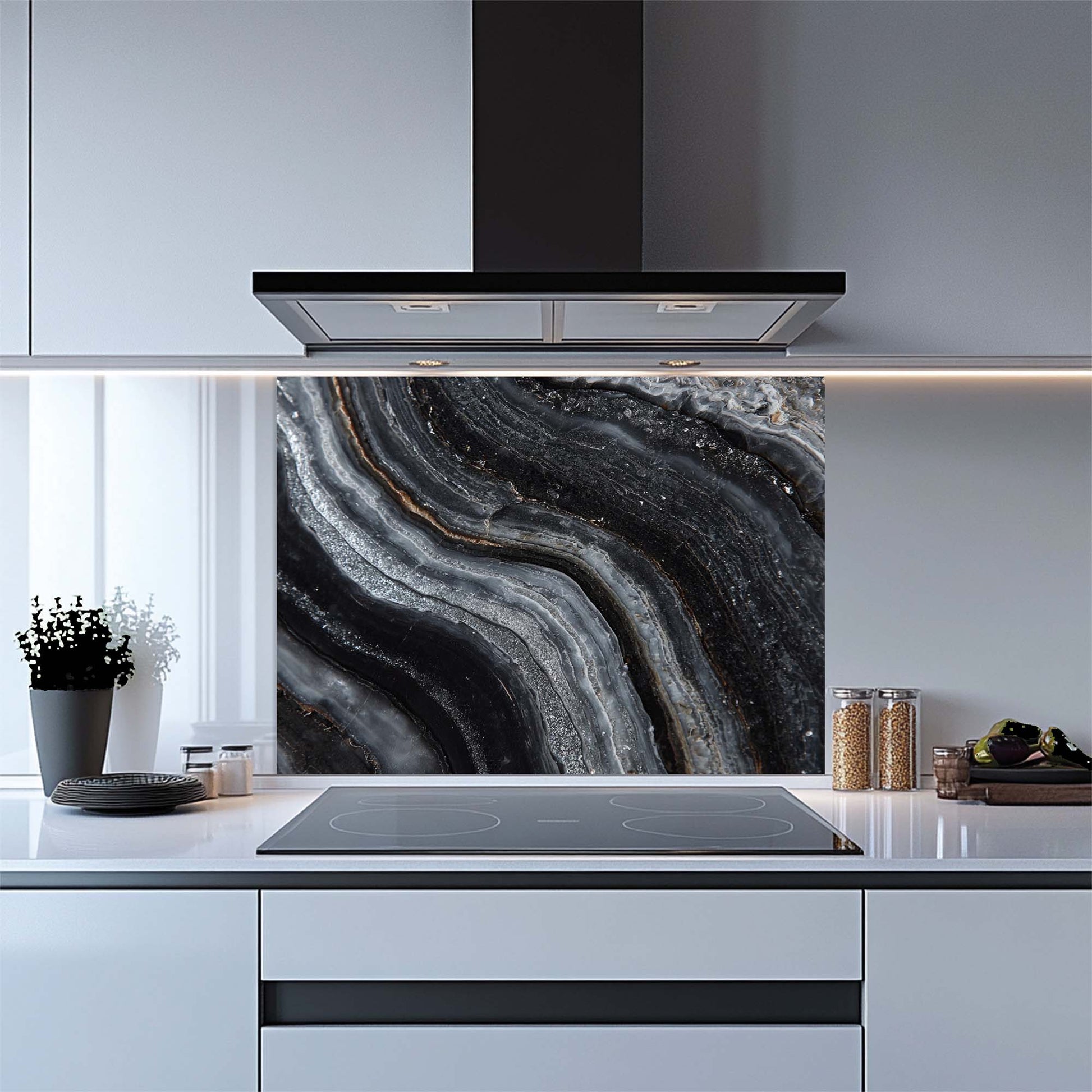 Modern kitchen with a black and gray abstract patterned glass splashback.
