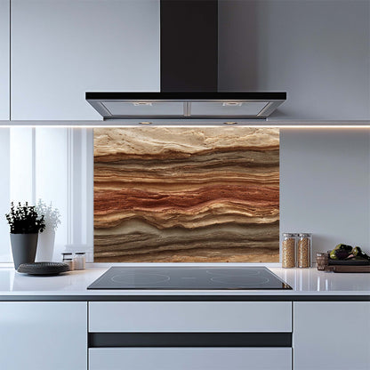 Modern kitchen with a decorative glass splashback featuring layered stone design.