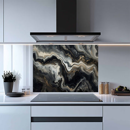 Modern kitchen with a decorative splashback panel featuring abstract black, gray, and white design.