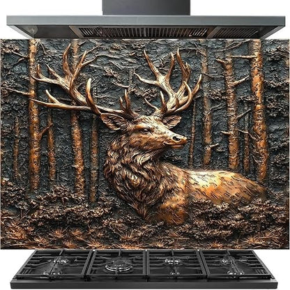 A large stainless steel range hood with a decorative backsplash featuring a detailed 3D-style relief of a stag deer in a forest, shown above a black gas range stove.