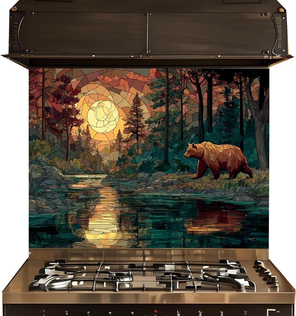 A stainless steel gas range with a large decorative kitchen backsplash featuring a stained-glass style forest scene with a bear, trees, moon, and water reflection.