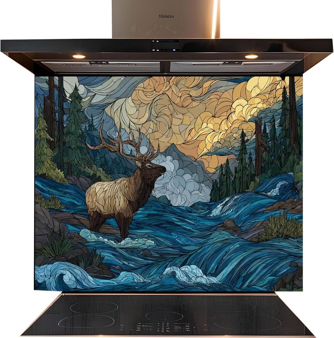 A decorative kitchen backsplash panel featuring a stained-glass style illustration of an elk standing in a blue river with mountains, trees, and dramatic clouds behind it. The panel is installed on a black induction range hood and cooktop against a white background.