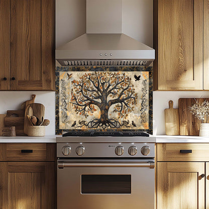 Stainless steel oven with decorative glass backsplash featuring a tree design in a kitchen setting.